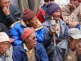 Mustang Lo Manthang Tiji Festival Day 2 01-3 Men On The Left Side Of the Square Men congregated mostly on the left side of the square for the second day of the Tiji Festival in Lo Manthang.